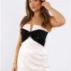 The Frolic Ivory / Black Sequin Bow Mini Dress